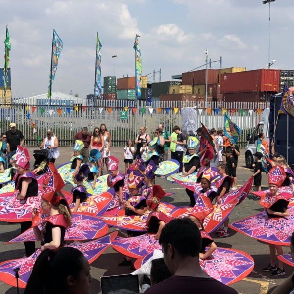 The Tilbury Carnival unveils Windrush stimulated flags to mark Windrush Day 2019