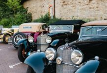 Garage full of antique vehicles and warm rods catches on fireplace
