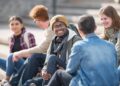 How do nurse practitioners support university students 4 Hanging out on campus A multi ethnic group of university students are hanging out outdoors on campus. university students stock pictures, royalty-free photos & images