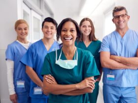 A picture containing person, standing, posing, group Description automatically generated