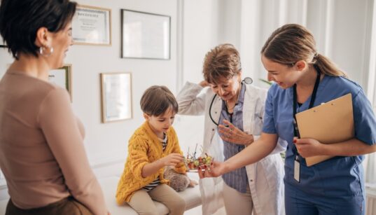 A group of people in a room Description automatically generated