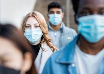 A group of people wearing masks Description automatically generated with medium confidence