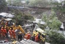 Photo of At least 15 useless as construction website wall collapses