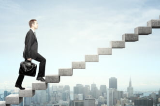 A person flying through the air over a city Description automatically generated