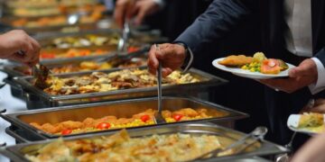 Two catering corporations have their food hygiene rankings downgraded after dozens left ill 8